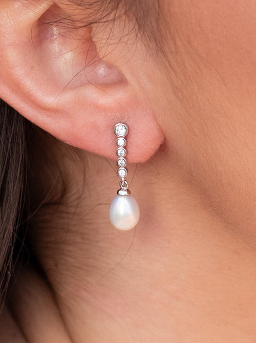 Pearl pendant earrings with zirconia design with movement