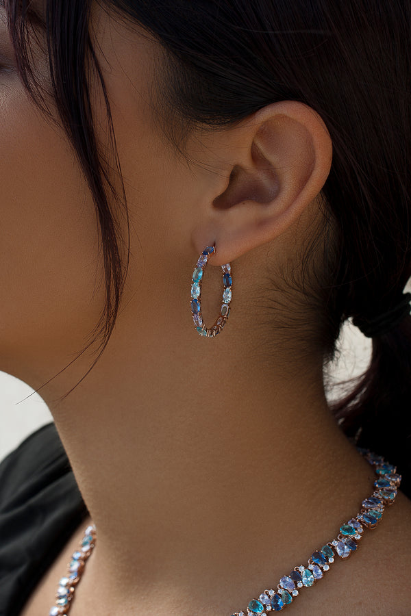 Earrings with colored stones in shades of blue and pink