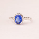 Oval sapphire zirconia ring with micro zirconia.