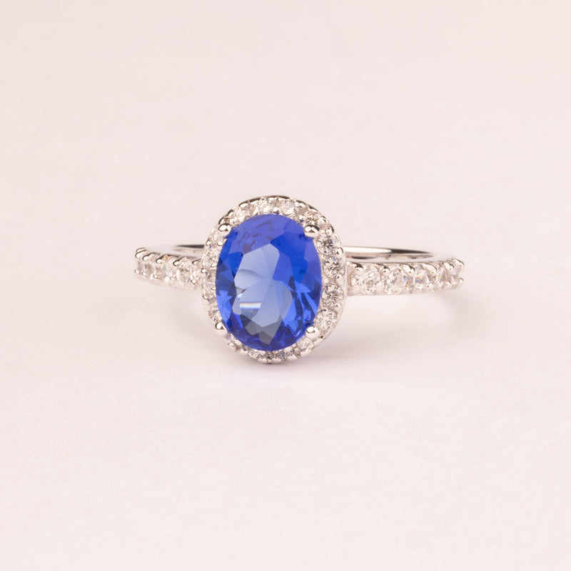 Oval sapphire zirconia ring with micro zirconia.