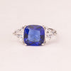 Square sapphire ring with triangular zirconia