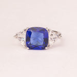 Square sapphire ring with triangular zirconia