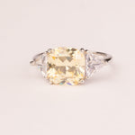 Square topaz ring with triangular zirconia