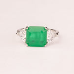 Square emerald ring with triangular zirconia