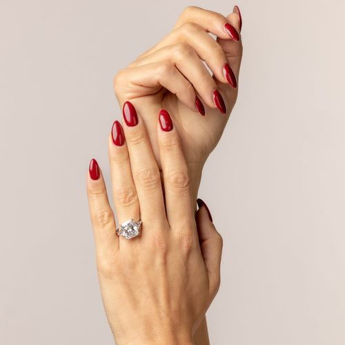 Ring with emerald cut white zircons