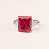 Ring with emerald cut ruby ​​zircons