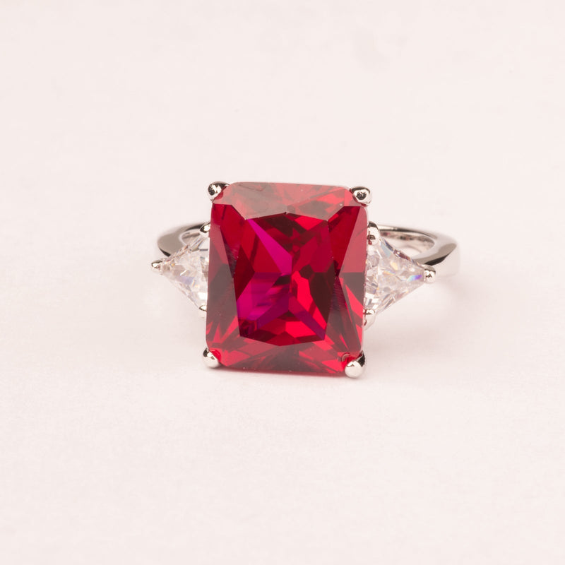 Ring with emerald cut ruby ​​zircons