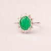 Oval emerald zirconia ring with white zirconia crown