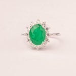 Oval emerald zirconia ring with white zirconia crown