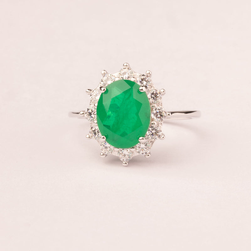 Oval emerald zirconia ring with white zirconia crown