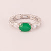 Wedding ring with oval emerald zirconia