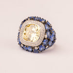 Rounded pave sapphire ring with contrasting center stone