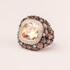 Rounded pave topaz ring with contrasting center stone