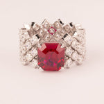 High and soft mesh with central emerald-cut ruby ​​zirconia