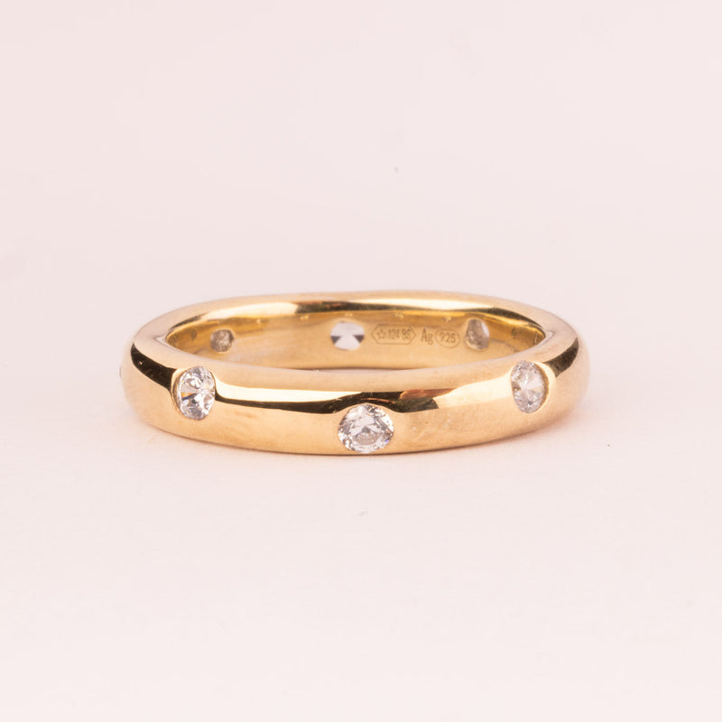 Plain ring with white zircons plated in 18k gold