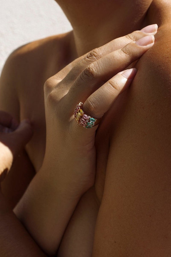 Ring with colored stones and bow in cool tones