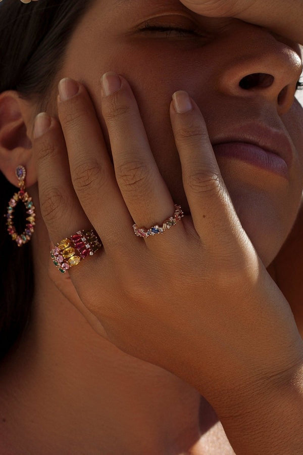 Ring with colored stones and bow in cool tones