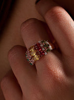 Ring with colored stones and bow in cool tones