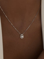 Brilliant Silver Pendant with Teardrop-Shaped Adamantine Quartz Motif and Zirconia Detail