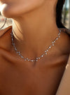 Party necklaces with a curvilinear floral design and zirconia 