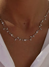 Party necklaces with a curvilinear floral design and zirconia 