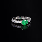 Wedding ring with oval emerald zirconia