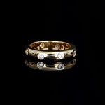 Plain ring with white zircons plated in 18k gold