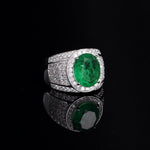 High central mesh ring with oval emerald zirconia