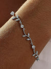 Thin silver bracelets with branch design and zircons 