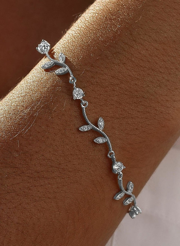 Thin silver bracelets with branch design and zircons 