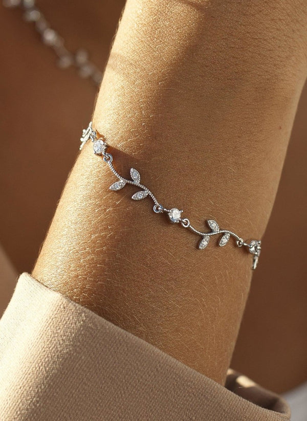 Thin silver bracelets with branch design and zircons 